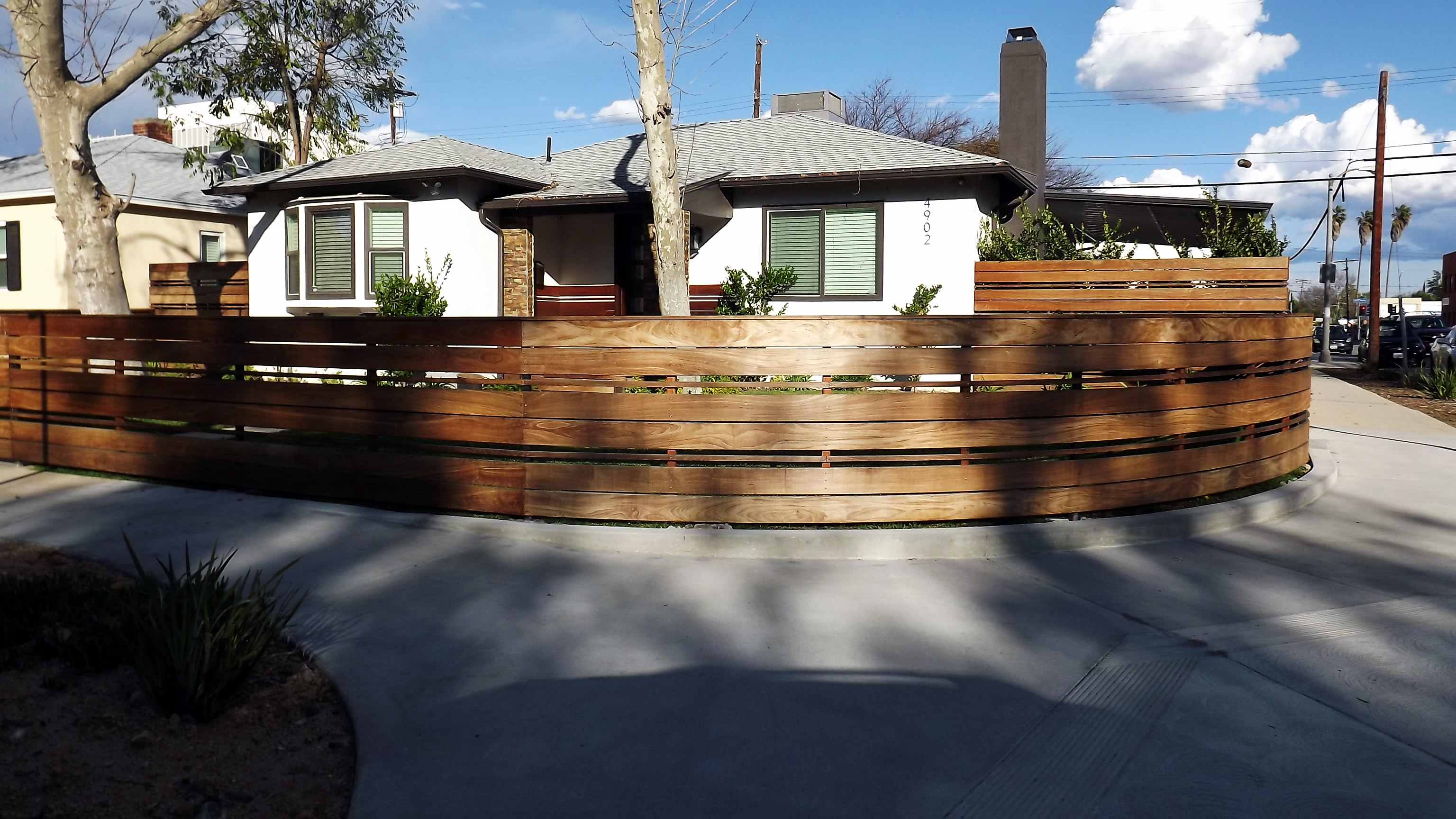 modern wooden curved fence